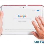 Two hands holding a tablet open to a search engine